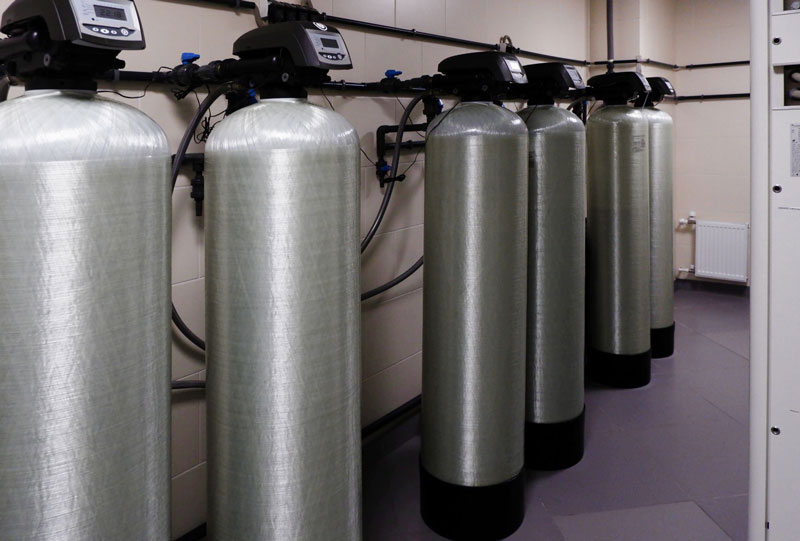 Industrial water softener tanks aligned