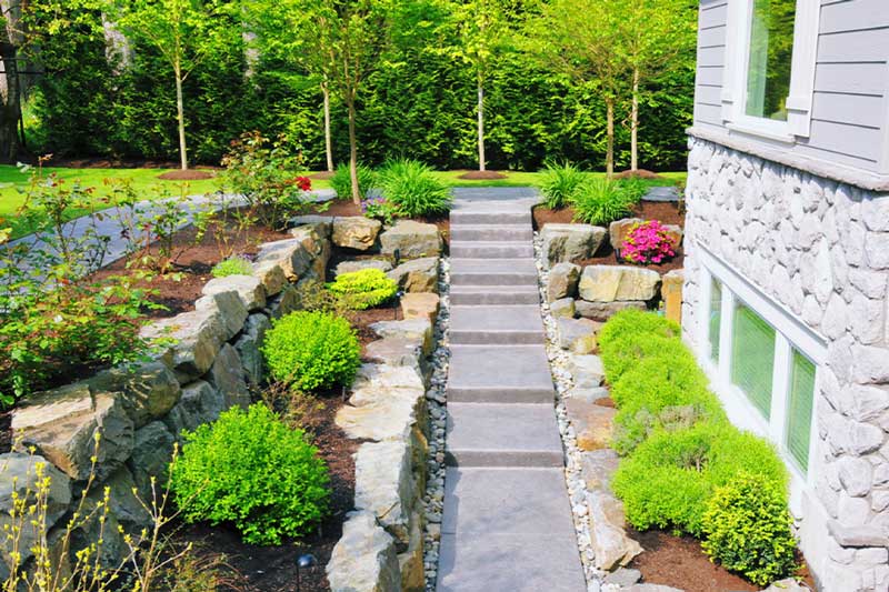 Garden path lined with stone walls
